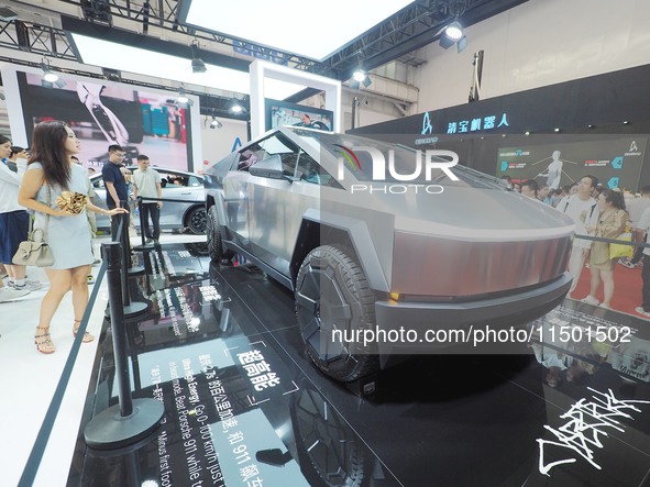 Visitors view the ''Tesla Cybertruck'' at the 2024 World Robot Conference in Beijing, China, on August 22, 2024. 