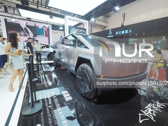 Visitors view the ''Tesla Cybertruck'' at the 2024 World Robot Conference in Beijing, China, on August 22, 2024. (