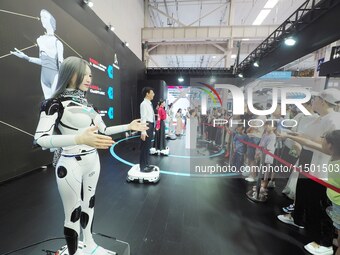 Visitors view a ''humanoid robot'' at the 2024 World Robot Conference in Beijing, China, on August 22, 2024. (