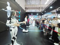 Visitors view a ''humanoid robot'' at the 2024 World Robot Conference in Beijing, China, on August 22, 2024. (