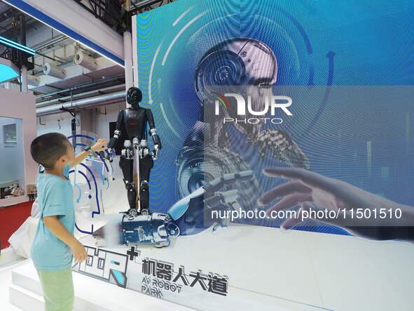 Visitors view a ''humanoid robot'' at the 2024 World Robot Conference in Beijing, China, on August 22, 2024. 