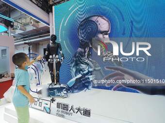 Visitors view a ''humanoid robot'' at the 2024 World Robot Conference in Beijing, China, on August 22, 2024. (