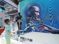 Visitors view a ''humanoid robot'' at the 2024 World Robot Conference in Beijing, China, on August 22, 2024. (