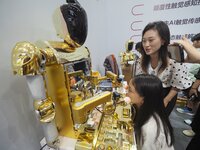 Visitors experience a ''cosmetic robot'' at the 2024 World Robot Conference in Beijing, China, on August 22, 2024. (