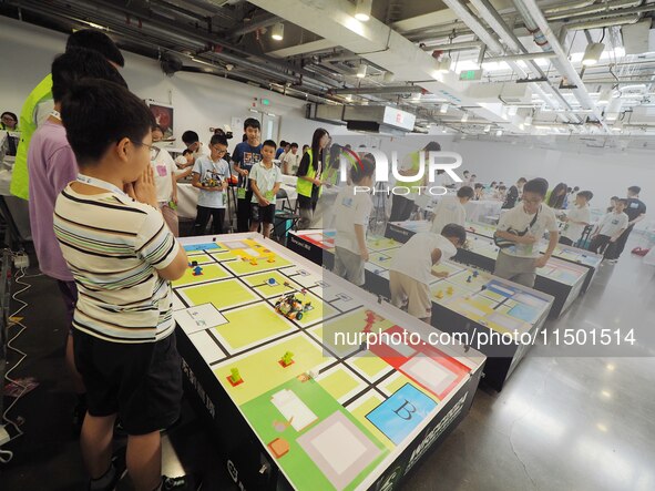 Young players compete at the 2024 World Robot Competition in Beijing, China, on August 22, 2024. 