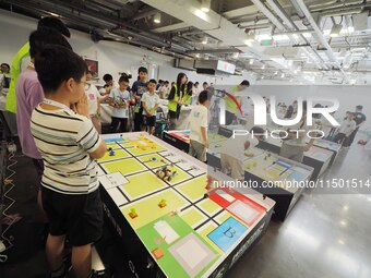 Young players compete at the 2024 World Robot Competition in Beijing, China, on August 22, 2024. (