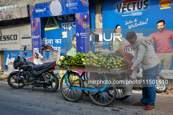 A man sells vegetables from a cart in Haldwani, Uttarakhand, India, on April 23, 2024. 