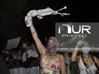 Protesters march in a pro-Palestinian demonstration at George Washington University in Washington, D.C., on August 22, 2024. During the spri...