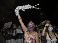 Protesters march in a pro-Palestinian demonstration at George Washington University in Washington, D.C., on August 22, 2024. During the spri...