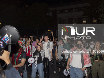 Protesters chant while joining a pro-Palestinian demonstration at George Washington University in Washington, D.C., on August 22, 2024. Duri...