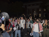 Protesters chant while joining a pro-Palestinian demonstration at George Washington University in Washington, D.C., on August 22, 2024. Duri...