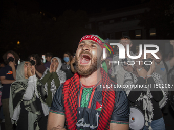 Protesters chant while joining a pro-Palestinian demonstration at George Washington University in Washington, D.C., on August 22, 2024. Duri...