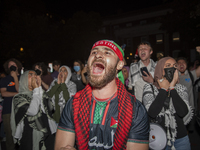 Protesters chant while joining a pro-Palestinian demonstration at George Washington University in Washington, D.C., on August 22, 2024. Duri...