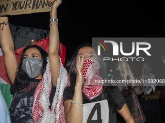 Protesters chant while joining a pro-Palestinian demonstration at George Washington University in Washington, D.C., on August 22, 2024. Duri...