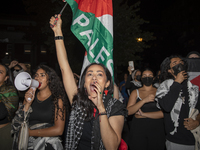 Protesters chant while joining a pro-Palestinian demonstration at George Washington University in Washington, D.C., on August 22, 2024. Duri...