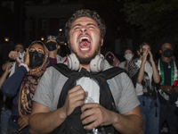 Protesters chant while joining a pro-Palestinian demonstration at George Washington University in Washington, D.C., on August 22, 2024. Duri...