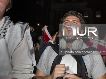 Protesters chant while joining a pro-Palestinian demonstration at George Washington University in Washington, D.C., on August 22, 2024. Duri...