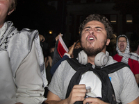 Protesters chant while joining a pro-Palestinian demonstration at George Washington University in Washington, D.C., on August 22, 2024. Duri...