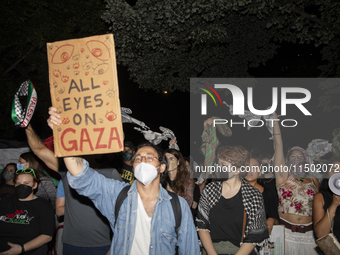 Protesters chant while joining a pro-Palestinian demonstration at George Washington University in Washington, D.C., on August 22, 2024. Duri...