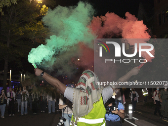 Protesters march in a pro-Palestinian demonstration at George Washington University in Washington, D.C., on August 22, 2024. During the spri...