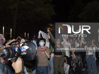 Protesters march in a pro-Palestinian demonstration at George Washington University in Washington, D.C., on August 22, 2024. During the spri...