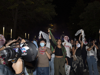 Protesters march in a pro-Palestinian demonstration at George Washington University in Washington, D.C., on August 22, 2024. During the spri...