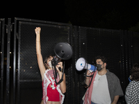 A protester chants while joining a pro-Palestinian demonstration at George Washington University in Washington, D.C., on August 22, 2024. Du...