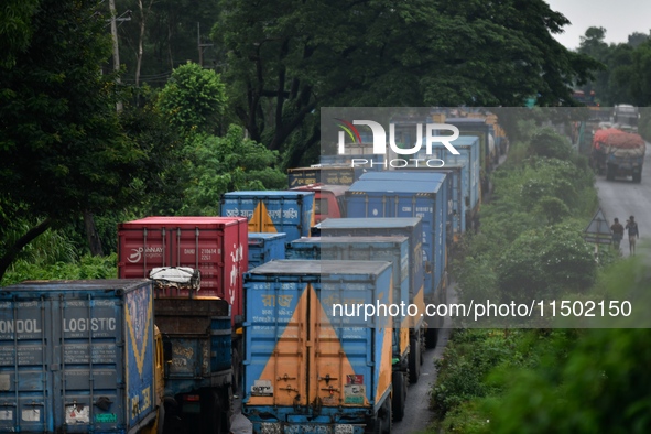 Vehicles are stuck on a highway in traffic due to flooding in Feni, Chittagong, Bangladesh, on August 23, 2024. 