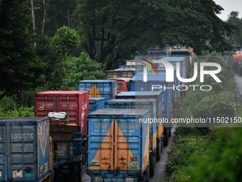 Vehicles are stuck on a highway in traffic due to flooding in Feni, Chittagong, Bangladesh, on August 23, 2024. (