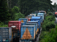 Vehicles are stuck on a highway in traffic due to flooding in Feni, Chittagong, Bangladesh, on August 23, 2024. (