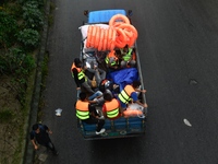 Volunteers carry life-saving gadgets on a truck to help flood-affected people in Comilla, Bangladesh, on August 23, 2024. (