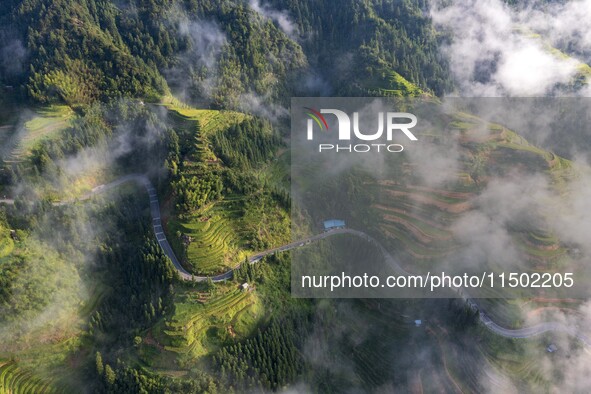 An aerial photo shows a rural road in Baidao village, Congjiang county, in Congjiang, China, on August 22, 2024. 