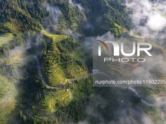 An aerial photo shows a rural road in Baidao village, Congjiang county, in Congjiang, China, on August 22, 2024. (