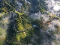 An aerial photo shows a rural road in Baidao village, Congjiang county, in Congjiang, China, on August 22, 2024. (