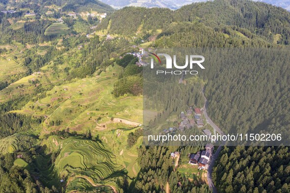 An aerial photo shows a rural road in Baidao village, Congjiang county, in Congjiang, China, on August 22, 2024. 