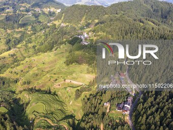 An aerial photo shows a rural road in Baidao village, Congjiang county, in Congjiang, China, on August 22, 2024. (