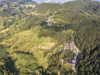 An aerial photo shows a rural road in Baidao village, Congjiang county, in Congjiang, China, on August 22, 2024. (