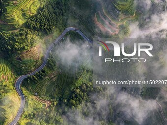 An aerial photo shows a rural road in Baidao village, Congjiang county, in Congjiang, China, on August 22, 2024. (