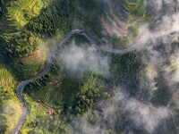 An aerial photo shows a rural road in Baidao village, Congjiang county, in Congjiang, China, on August 22, 2024. (