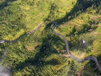 An aerial photo shows a rural road in Baidao village, Congjiang county, in Congjiang, China, on August 22, 2024. (