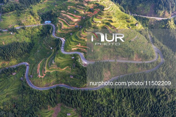 An aerial photo shows a rural road in Baidao village, Congjiang county, in Congjiang, China, on August 22, 2024. 