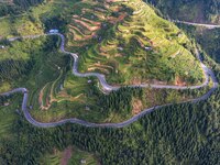 An aerial photo shows a rural road in Baidao village, Congjiang county, in Congjiang, China, on August 22, 2024. (