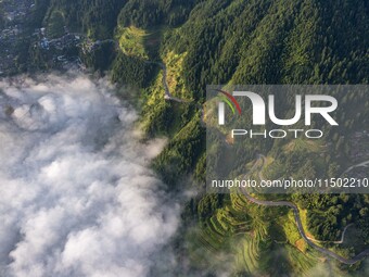 An aerial photo shows a rural road in Baidao village, Congjiang county, in Congjiang, China, on August 22, 2024. (