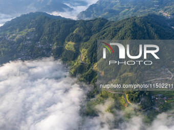 An aerial photo shows a rural road in Baidao village, Congjiang county, in Congjiang, China, on August 22, 2024. (