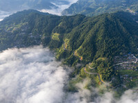 An aerial photo shows a rural road in Baidao village, Congjiang county, in Congjiang, China, on August 22, 2024. (