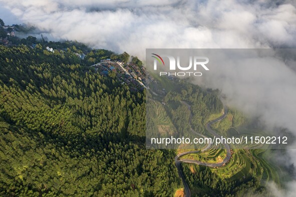 An aerial photo shows a rural road in Baidao village, Congjiang county, in Congjiang, China, on August 22, 2024. 