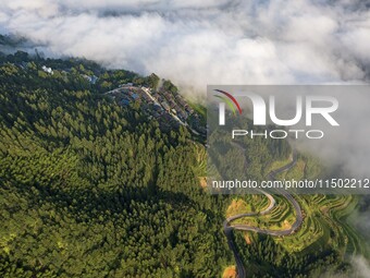 An aerial photo shows a rural road in Baidao village, Congjiang county, in Congjiang, China, on August 22, 2024. (