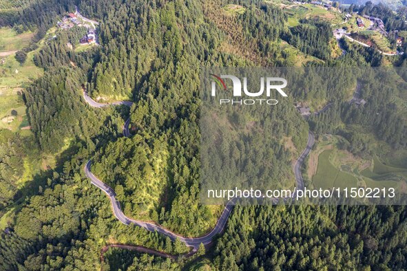 An aerial photo shows a rural road in Baidao village, Congjiang county, in Congjiang, China, on August 22, 2024. 