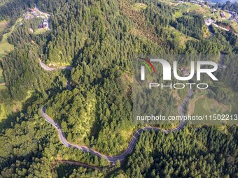 An aerial photo shows a rural road in Baidao village, Congjiang county, in Congjiang, China, on August 22, 2024. (