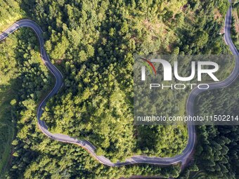 An aerial photo shows a rural road in Baidao village, Congjiang county, in Congjiang, China, on August 22, 2024. (